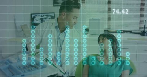 Dentist Discussing Treatment with Patient in Modern Clinic