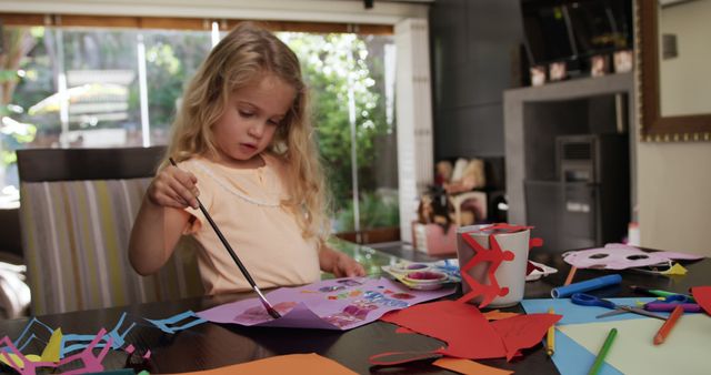 Young Girl Creating Colorful Paper Art Crafts on Table - Download Free Stock Images Pikwizard.com