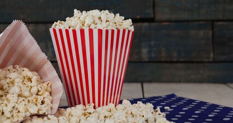 Popcorn in Classic Striped Box on Wooden Table - Download Free Stock Images Pikwizard.com