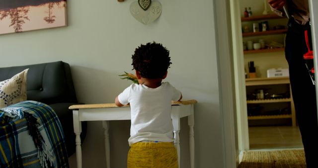 Child Playing in Living Room with Parent Nearby - Download Free Stock Images Pikwizard.com