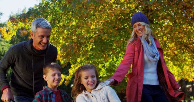 Happy Family Enjoying Autumn Day Outdoors in Park - Download Free Stock Images Pikwizard.com