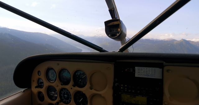 Cockpit View of Light Aircraft Flying Over Mountainous Landscape - Download Free Stock Images Pikwizard.com