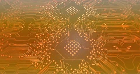 Orange PCB Closeup Showing BGA Footprint, Radial Traces, Reflective Copper Pads