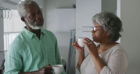Senior Couple Enjoying Morning Coffee Together at Home