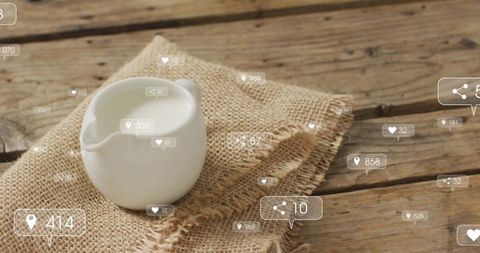 Rustic ceramic milk jug with digital social media engagement icons