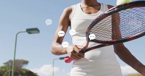 Pregnant Woman Balancing Tennis Ball on Racquet Outdoors
