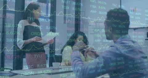 Corporate Team Analyzing Financial Market Data in Office