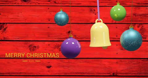 Festive Christmas Ornaments over Bright Red Wood