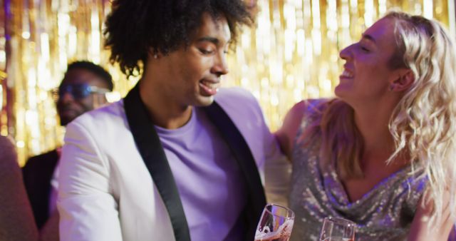 Image of happy diverse couple dancing holding glasses of champagne at a nightclub - Download Free Stock Photos Pikwizard.com