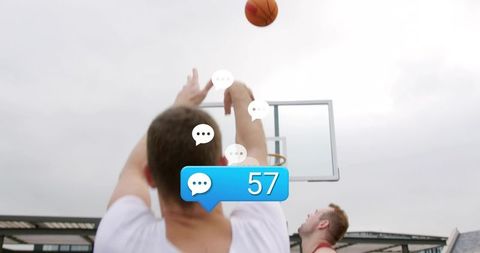 Street basketball player shooting with social comment badge 57, urban hoop action, dynamic play
