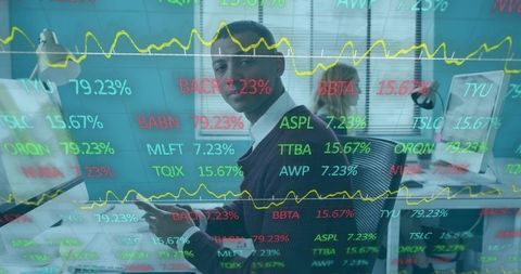 Businessman Monitoring Stock Market Trends in Modern Office