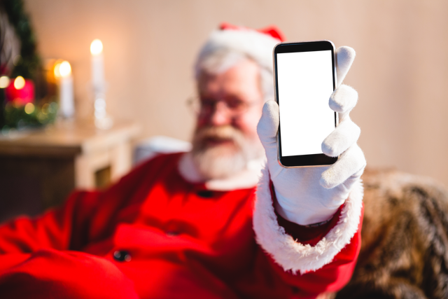 Close-up of Santa Claus Showing Smartphone with Transparent Screen - Download Free Stock Videos Pikwizard.com