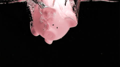 Piggy Bank Surfaces Water Dramatically Displaying Financial Concept