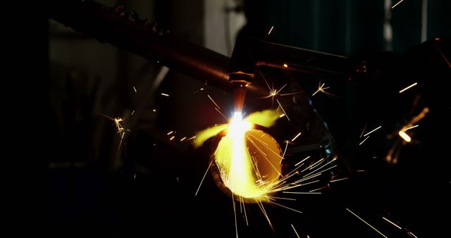 Welder Welding Metal with Bright Sparks in Dark Workshop - Download Free Stock Images Pikwizard.com