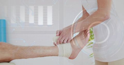 Clinician wrapping ankle bandage with futuristic hud overlay for sports rehab and physiotherapy