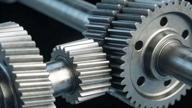 Meshing steel spur gears on shafts highlighting precision gearbox components