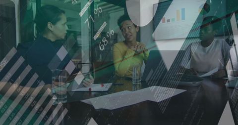 Colleagues Analyzing Financial Data in Office Meeting Room