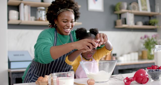 Happy African American Mother and Daughter Baking Together at Home - Download Free Stock Images Pikwizard.com