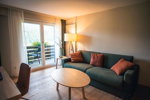 Cozy Modern Living Room with Natural Light and Balcony