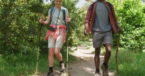 Happy Couple Hiking with Backpacks in Sunny Park - Download Free Stock Images Pikwizard.com
