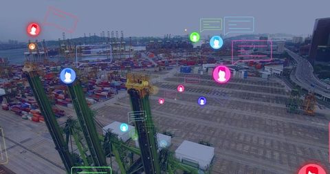 Green gantry cranes lifting containers at smart port with digital data overlays