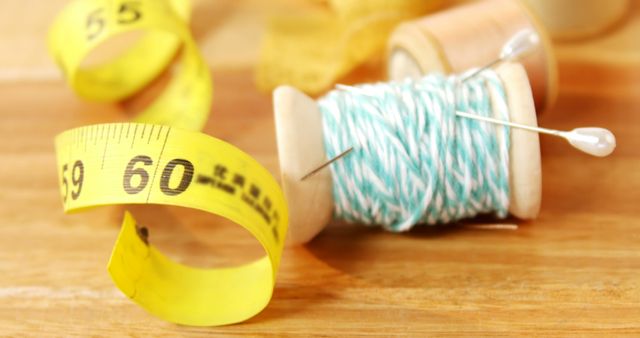 Yellow Measuring Tape and Spool of Twine on Wooden Surface - Download Free Stock Images Pikwizard.com