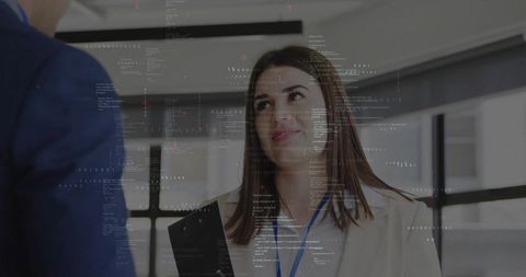 Professional business briefing with colleague in modern office setting