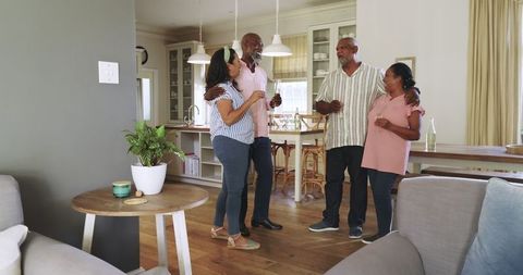 Diverse Seniors Celebrating Joyfully at Cozy Home Gathering