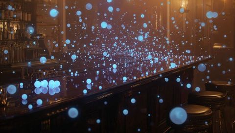 Glowing blue orbs floating above polished dark wood bar counter reflecting amber lights