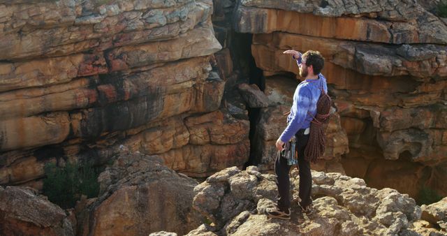 Male Rock Climber with Ropes Planning Route on Rocky Cliff - Download Free Stock Images Pikwizard.com