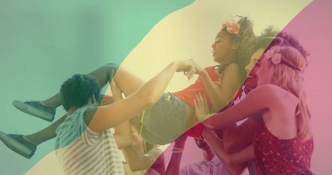 Friends celebrating with joyful lifting and colorful background