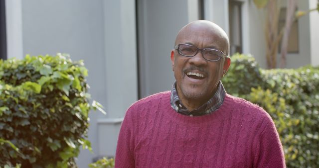 Smiling Elderly Man in Red Sweater Outdoors - Download Free Stock Images Pikwizard.com