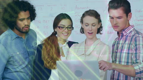 Diverse Team Collaborating on Digital Project with Laptop