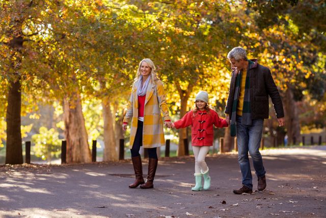 Family Enjoying Autumn Walk in Park - Download Free Stock Photos Pikwizard.com