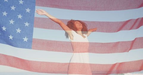 Joyful Woman Raising Arms with Overlay of American Flag