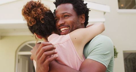Happy Biracial Couple Embracing in Front of New Home - Download Free Stock Images Pikwizard.com