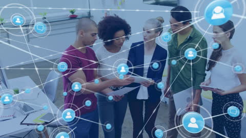 Diverse Business Team Analyzing Network Diagrams in Modern Office