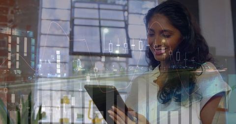 Businesswoman Analyzing Stocks on Tablet with Graphs Overlay