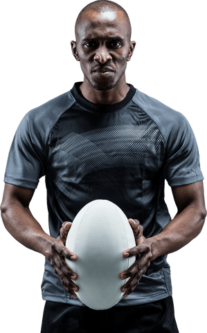 Serious athlete holding rugby ball on transparent background