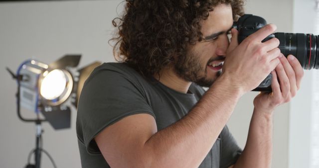 Male Photographer with Camera in Photography Studio Setting - Download Free Stock Images Pikwizard.com