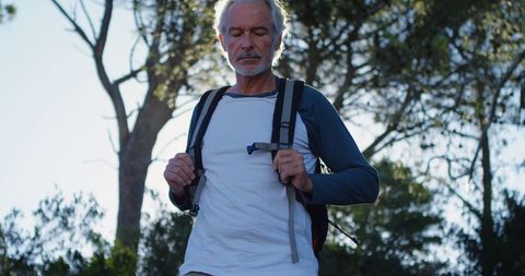 Active Senior Man Hiking in Sunlit Forest - Download Free Stock Images Pikwizard.com