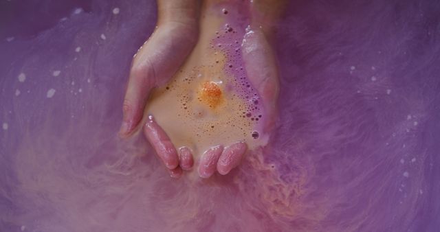 Hands Holding Colorful Bath Bomb in Purple Water - Download Free Stock Images Pikwizard.com