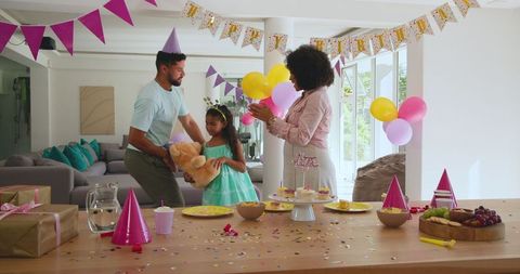 Joyful Family Celebration with Birthday Decorations and Gifts at Home