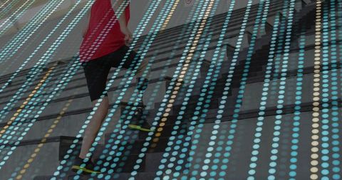 Athletic Man Climbing Outdoor Stairs with Dynamic Dot Overlay