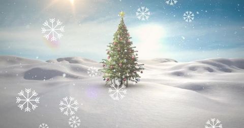 Decorated christmas tree standing on snowfield with sun flare and falling snowflakes