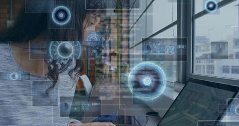 Woman working with interactive digital interface overlay in urban office