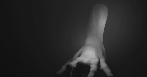 Creepy Hand Crawling in Darkness for Horror Theme