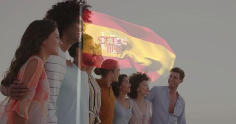 Group of Friends Celebrating Unity with Spanish Flag Backdrop