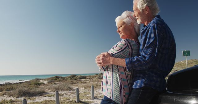 Senior Couple Embracing on Beachfront Roadside - Download Free Stock Images Pikwizard.com