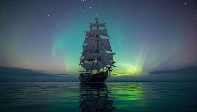 Majestic three-masted sailing ship under aurora borealis